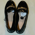 New Look Wide Fit Black Patent Chain Loafers with a gold tone metallic chain detail
