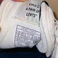 Levi's Stryder Red Tab sneakers in white and navy retro inspired design