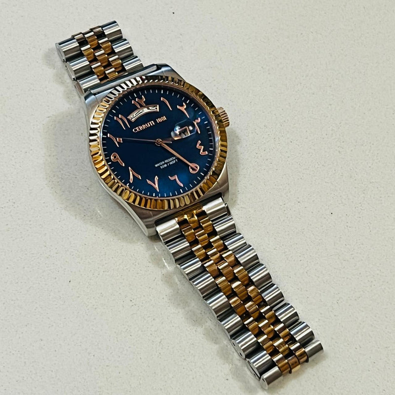 The Cerruti 1881 Chienti men's watch two tone bracelet and a blue dial with Arabic numerals