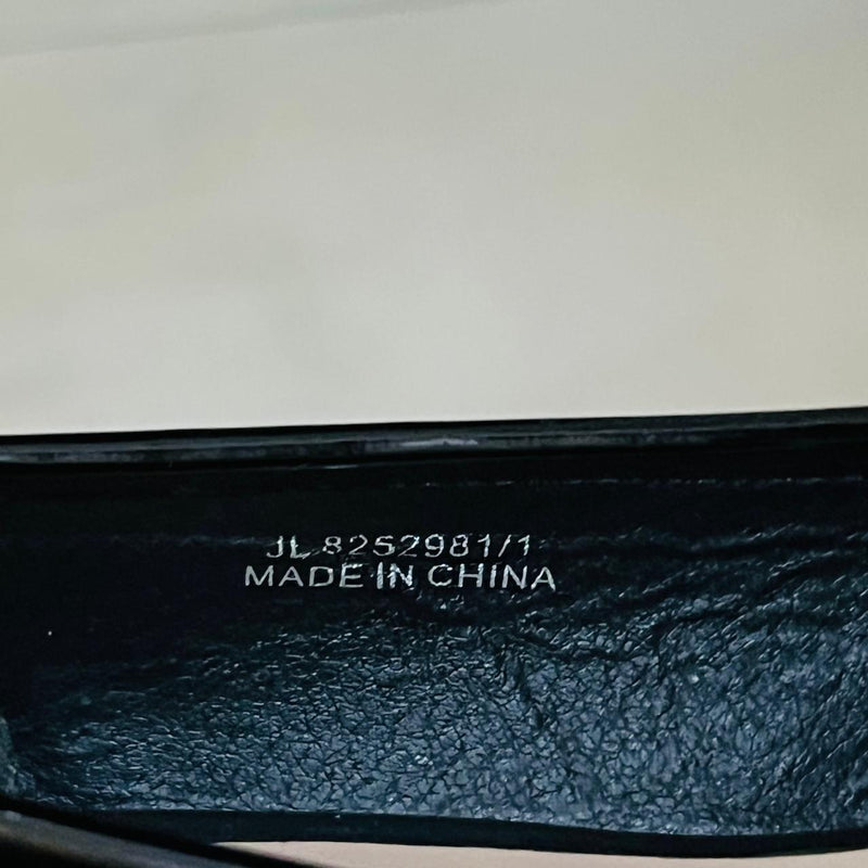 New Look Wide Fit Black Patent Chain Loafers with a gold tone metallic chain detail
